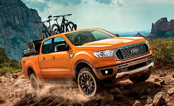 2019 Ford Ranger Blue Lightning with bike rack climbing a mountain
